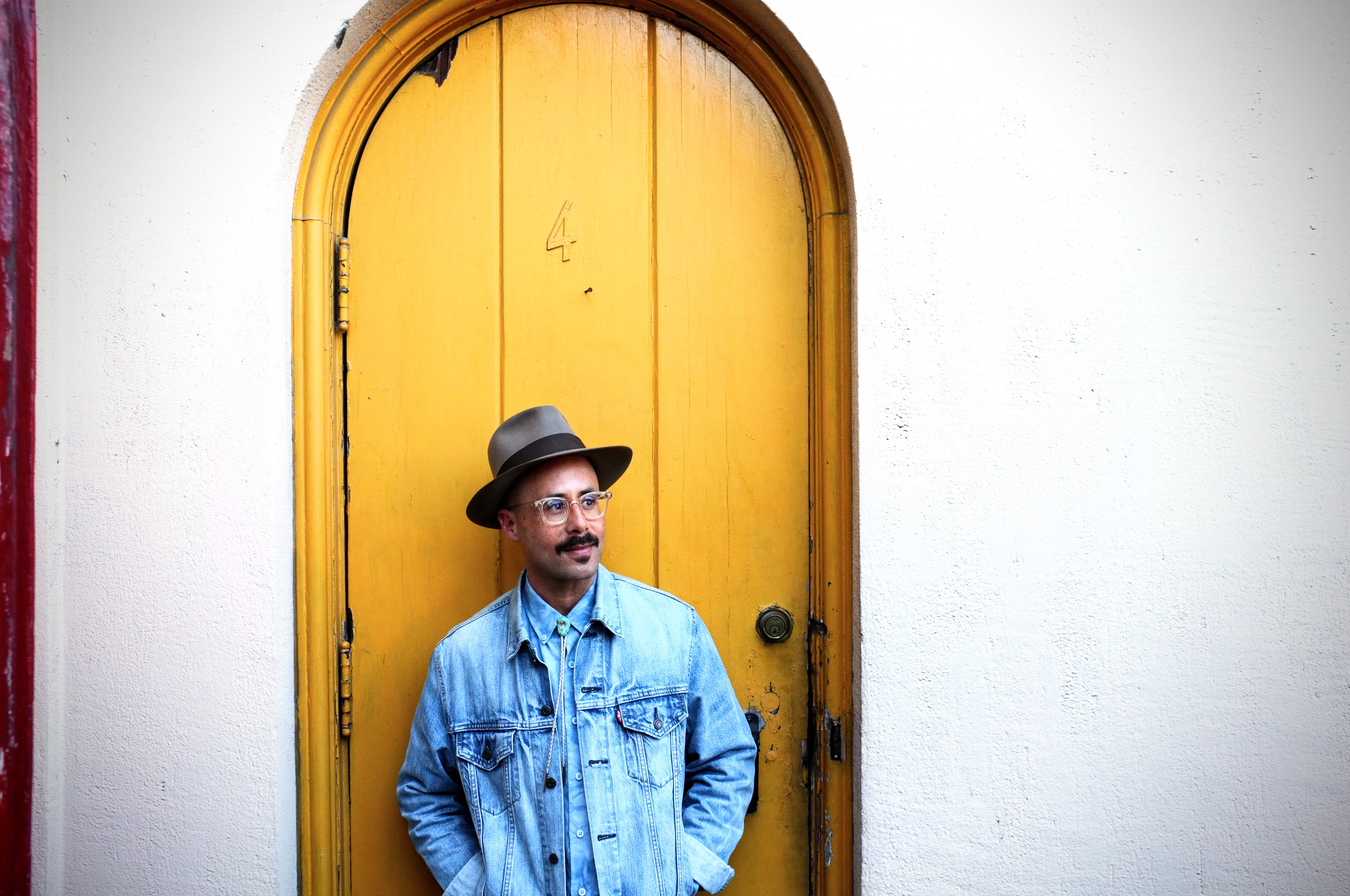 Jaime Tjahaja press photo at yellow door